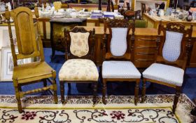 A Collection Of Four Dining Chairs To include two carved back dining chairs with blue jacquard