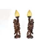 Two Oriental Carved Rootwood Figural Lamps A pair of 19th century hand carved lamps In the form Of