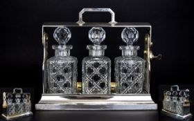 Edwardian Silver Plated Tantalus Containing 3 ( Three ) Cut Glass Decanters,