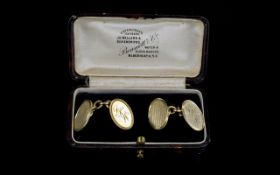 Art Deco Period 9ct Gold - Pair of gentleman's cuff links of oval shape and solid form.