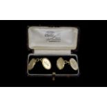 Art Deco Period 9ct Gold - Pair of gentleman's cuff links of oval shape and solid form.