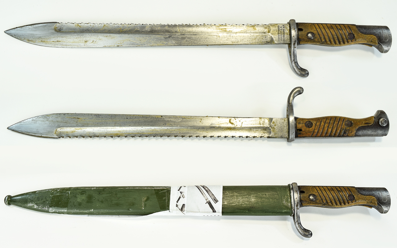 German - Mauser A.G World War I Saw Back ' Butcher ' Bayonet and Scabbard. Dated 1916.