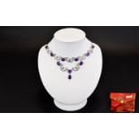 A Silver And Amethyst Necklace Delicate necklace on fine silver chain with 10 amethyst cabochons set