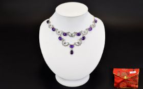 A Silver And Amethyst Necklace Delicate necklace on fine silver chain with 10 amethyst cabochons set