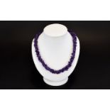 Amethyst Necklace A Two strand rope style necklace comprising multiple Amethyst chips with silver