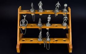 Ten Decorative Novelty Wine Stoppers housed in a pine rack with a capacity to hold 18 stoppers.