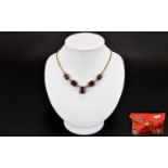 African Ruby And White Topaz Necklace Elegant necklace set with five rectangular step cut rubies,