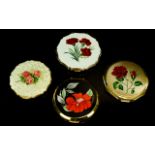 A Small Collection Of Vintage Stratton Compacts Four in total, each with a floral theme.