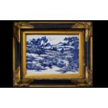 A Framed Chinese Ceramic Tile In The Dutch Style Blue and white 20th century Chinese tile depicting