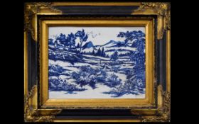 A Framed Chinese Ceramic Tile In The Dutch Style Blue and white 20th century Chinese tile depicting