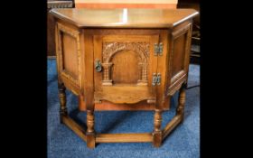A Rustic Oak Corner Cabinet By Old Charm Small cabinet with turned legs and carved foliate arch