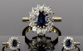 18ct Gold Attractive and Very Nice Quality Diamond and Sapphire Cluster Ring. The Central Sapphire (