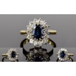 18ct Gold Attractive and Very Nice Quality Diamond and Sapphire Cluster Ring. The Central Sapphire (