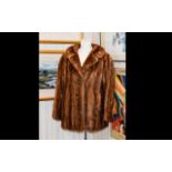 Ladies Mid Brown Mink Jacket. Fully lined with monogrammed vent and buttons on the back.