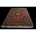 A Large Woven Silk Carpet Grand Keshan carpet on red ground with navy,