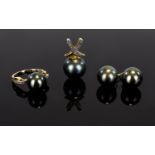 A 9ct Gold And Black Tahitian Pearl Jewellery Suite Three items in total comprising unusual ring,