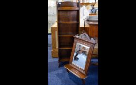 A Small Oak Bookshelf Wall mounted bookself with five shelves in aged oak.