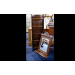 A Small Oak Bookshelf Wall mounted bookself with five shelves in aged oak.