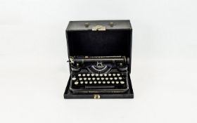 A Vintage Underwood Portable Typewriter Cased typewriter in traditional black lacquer finish with
