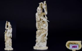 Japanese - Signed and Early 20th Century Carved Ivory Okimono Figure of Mythical Male Character