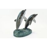 Robert Wyland - Impressive Painted Bronze Sculpture of a Pair of Dolphins.