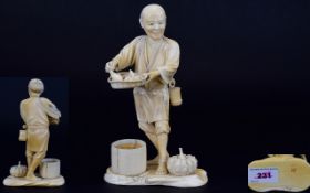 Japanese Fine Quality Signed Early 20th Century Carved Ivory Figure of a Japanese Male Holding a