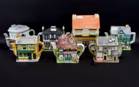 Collection Of 7 Novelty Teapots, Made By The Village & BBC Worldwide Limited. Together With A
