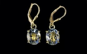 Green Amethyst Pair of Drop Earrings, oval solitaires of green amethyst, totalling 5cts,