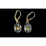 Green Amethyst Pair of Drop Earrings, oval solitaires of green amethyst, totalling 5cts,