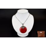 A Red Coral Disc Pendant With Silver Chain Long silver box chain with attached circular pendant