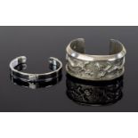 Silver African Elephant Design Cuff And Silver Tone Statement Cuff Two items in total, the first a