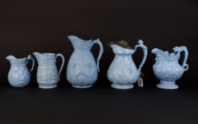 Collection of 19th Century Blue Moulded Wine Related Jugs, one, pewter lidded,