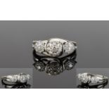 9ct White Gold Diamond Set Cluster Ring In The Form of 3 Flower Heads.