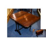 Antique Mahogany Sutherland Table A small drop leaf table with aged patina and gilt trim to turned