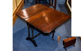 Antique Mahogany Sutherland Table A small drop leaf table with aged patina and gilt trim to turned