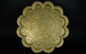 A Decorative Anglo Indian Brass Charger Large circular wall decoration with scalloped edges and