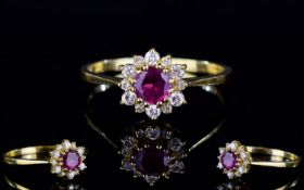 18ct Gold Dress Ring, Set With A Central Ruby Surrounded By Small Round Cut Diamonds, Fully