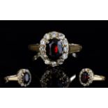9ct Gold Set Diamond and Ruby Cluster Ring.
