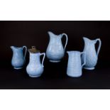 Five Various Aesthetic Period Blue Moulded Jugs,