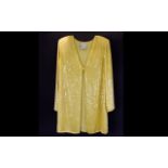 A Ladies Longline Evening Jacket By Frank Usher Sequinned jacket in primrose yellow,