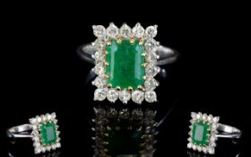 18ct White Gold Emerald and Diamond Set Cluster Ring of Nice Quality.