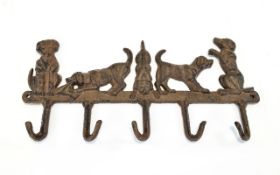 A Cast Iron 5 x Hook Key Holder In The Form of 5 Dogs. 13.3/4 x 6.5 Inches.