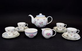 Pretty Floral Tea Set, comprising teapot, 4 cups, 4 saucers & 4 side plates together with a milk jug