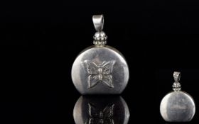 A Mexican Silver Decorative Perfume/Attar Pendant A small silver circular flask with flat base and