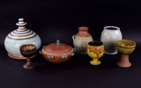 A Collection Of Decorative Earthenware Items Seven items in total to include Ghanaian lidded bowl,