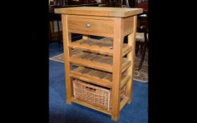 A Solid Oak Wine Rack Contemporary wine rack with 4 storage shelves and woven basket for storage to