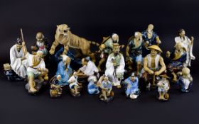 A Collection of Oriental Ceramic Decorative Figures (20) in total. Various sizes and poses.