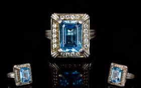 Ladies Silver Swiss Blue And White Topaz Dress Ring The central step cut brilliant blue central