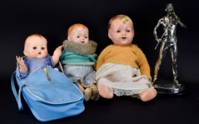 Three Old Dolls comprising a Pedigree doll with blue eyes, moveable joints and original carry case,