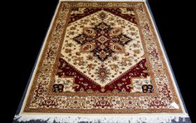 A Large Woven Silk Carpet Keshan rug with beige ground and traditional Middle Eastern floral and